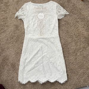 White lace dress with mesh front.